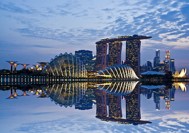 a city skyline with a body of water