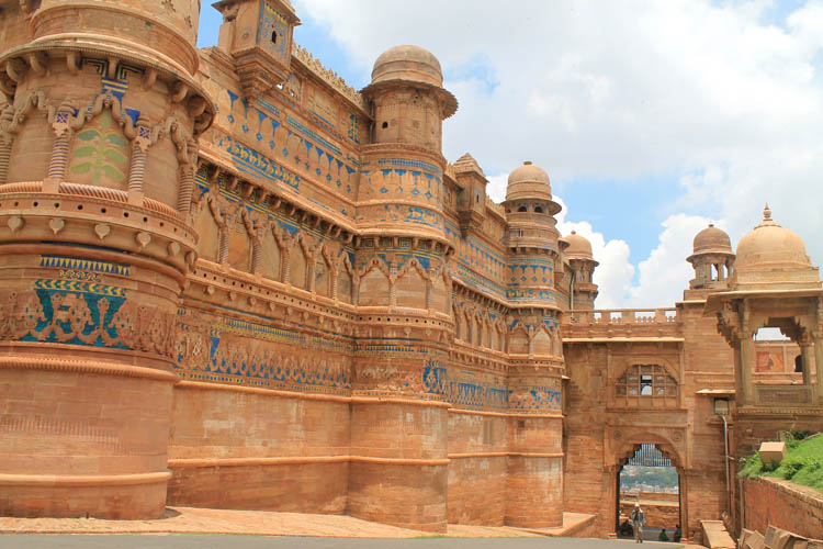 a large stone building with blue and gold designs